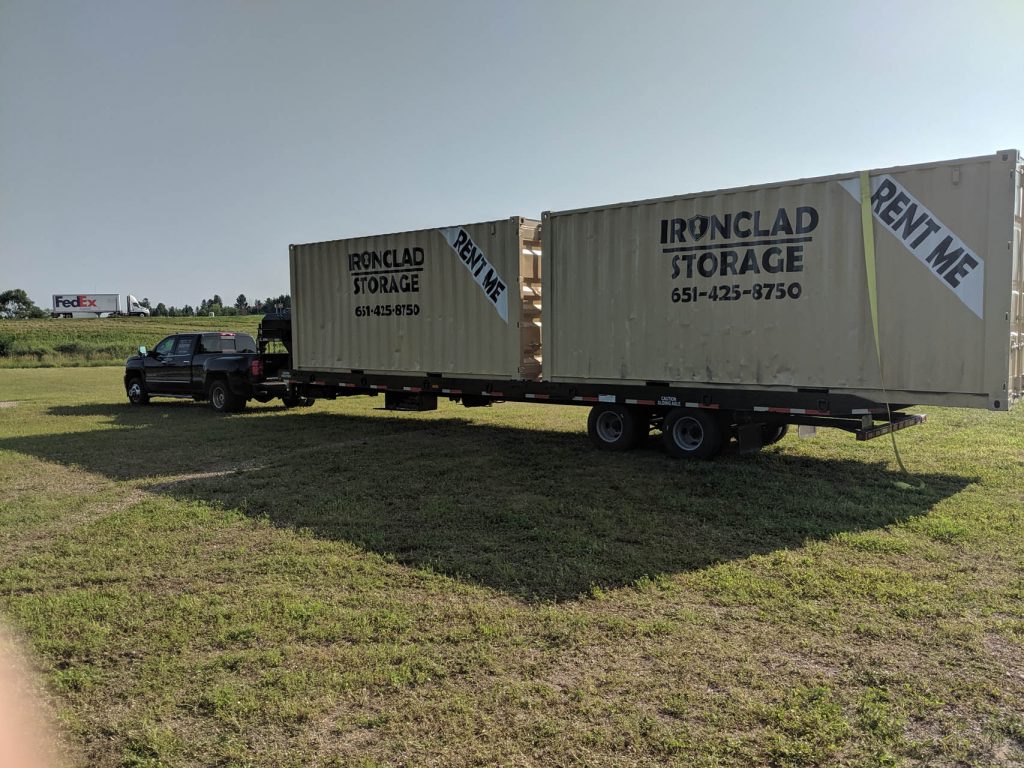 Two 20 Foot Storage Containers loaded on Truck for Delivery Two 20 Foot Storage Containers loaded on Truck for Delivery